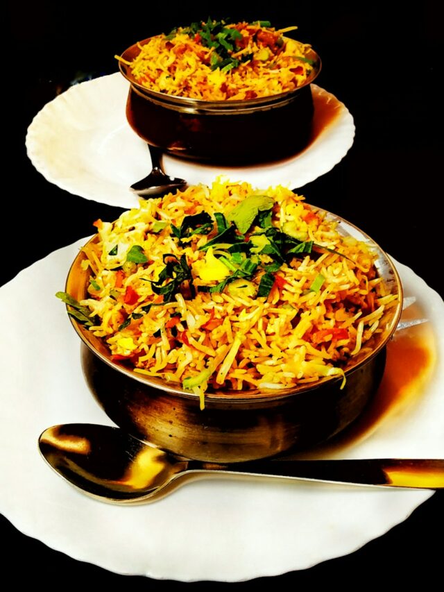 two plates of food on a black table